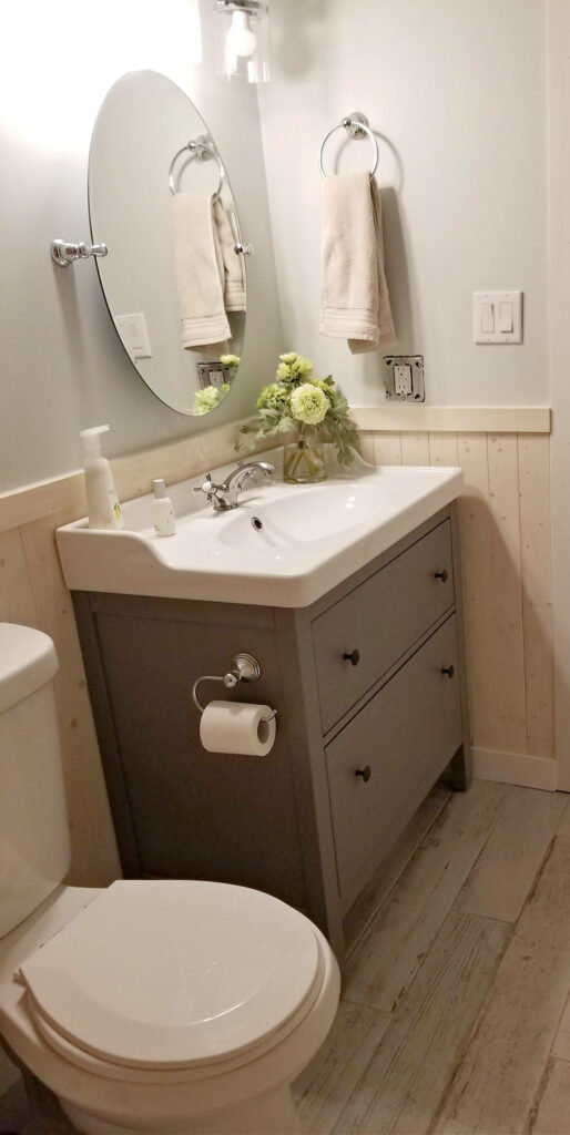 bathroom vanity and mirror after cottage style bathroom reno