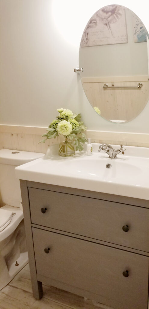 bathroom vanity and mirror after cottage style bathroom reno