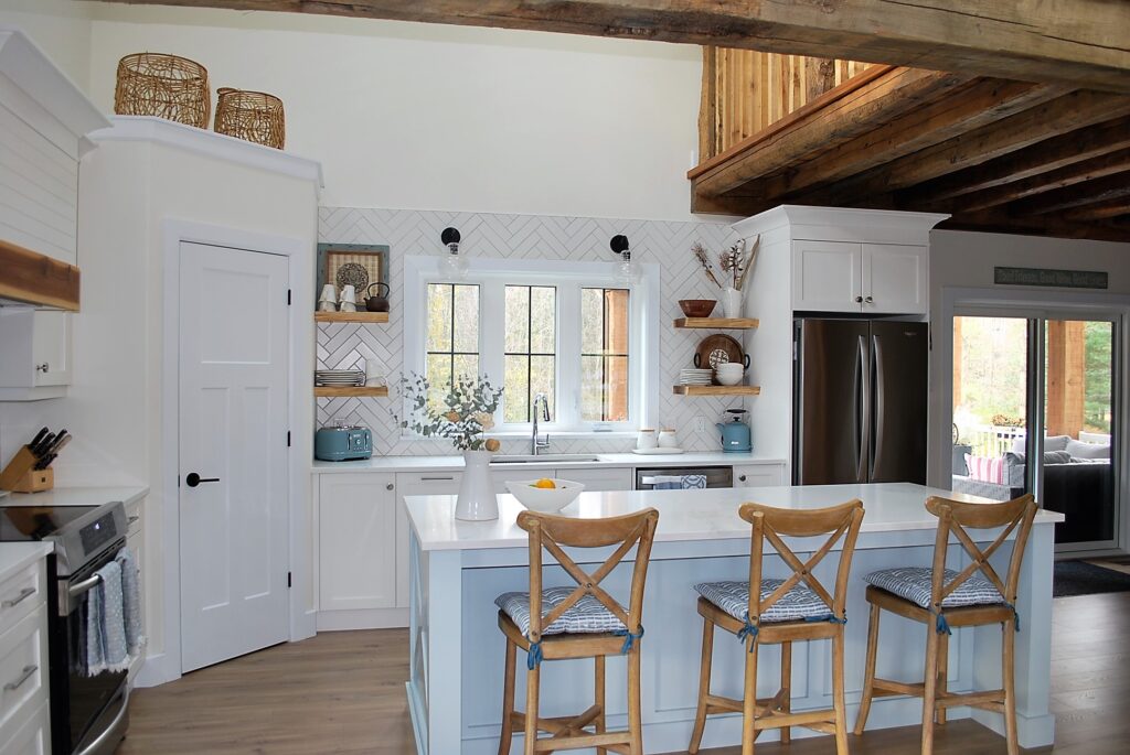 modern farmhouse kitchen with herringbone backsplash and central island